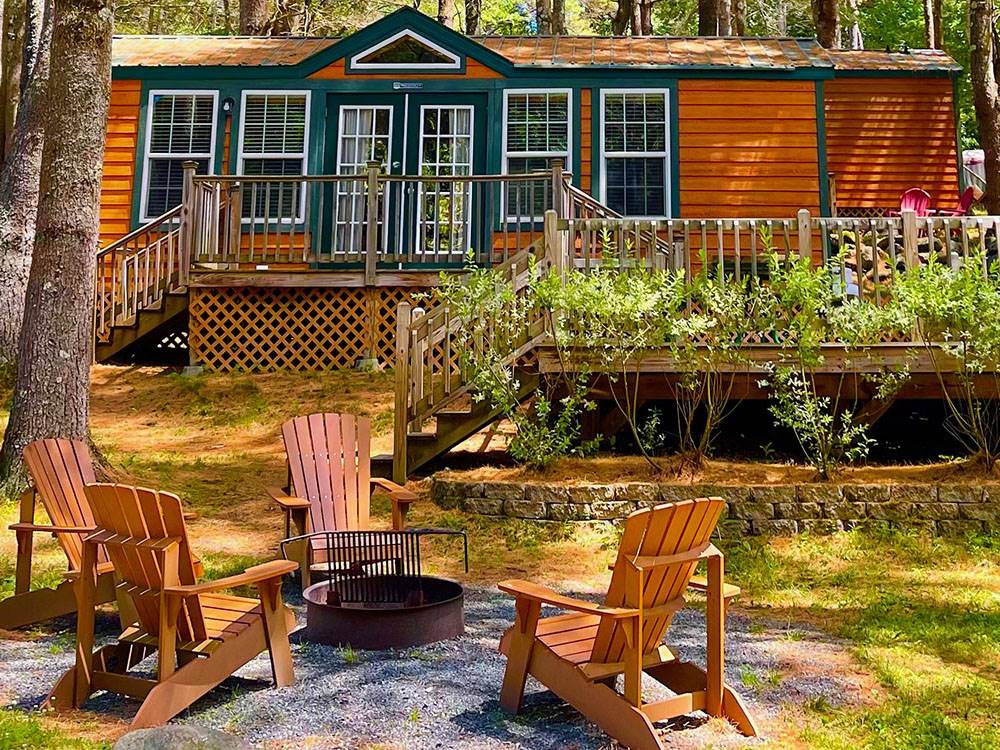 View of a rental cabin from fire ring seating