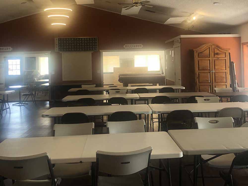 Tables and chairs in the rec room at MISSION VIEW RV RESORT