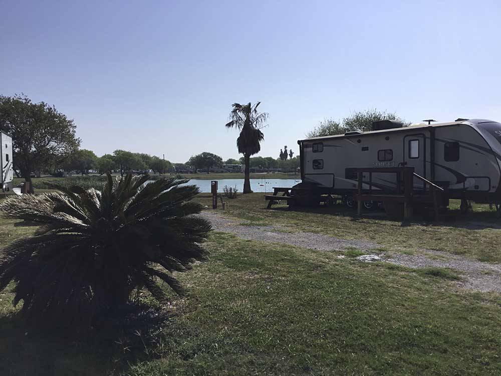  A fifth wheel parked in a gravel site at SEAWIND RV RESORT ON THE BAY