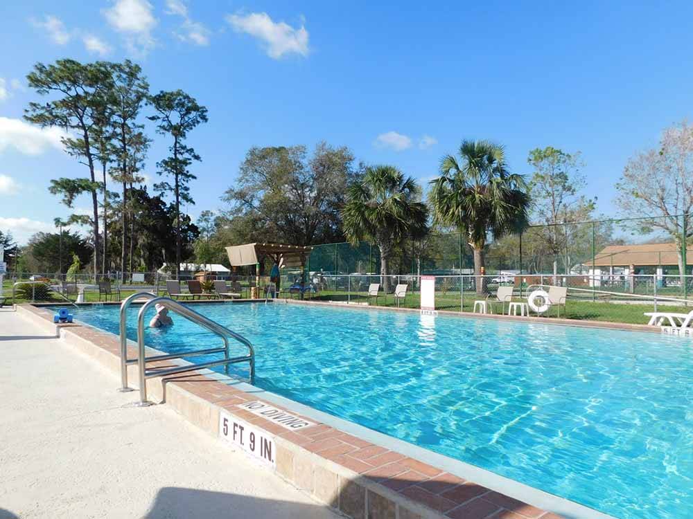 The large pool with seating at THE SPRINGS RV RESORT