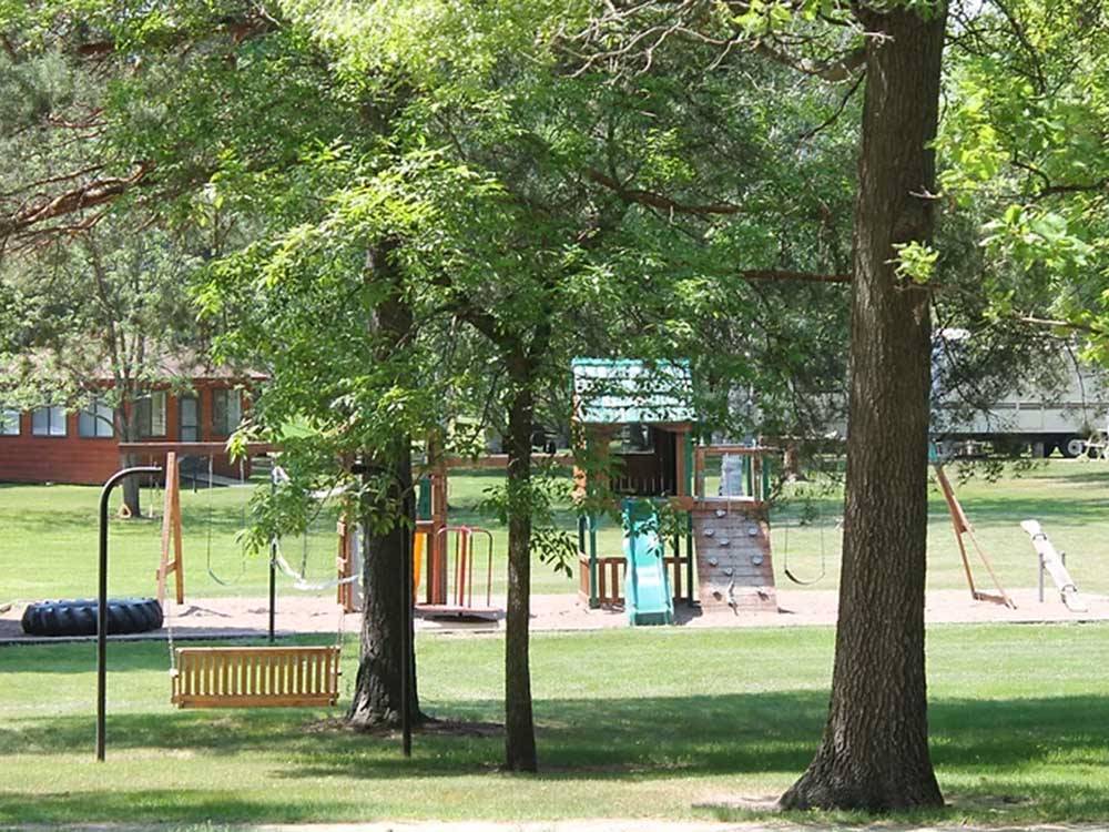Play area with slides, swing set and more at ST CLOUD CAMPGROUND & RV PARK