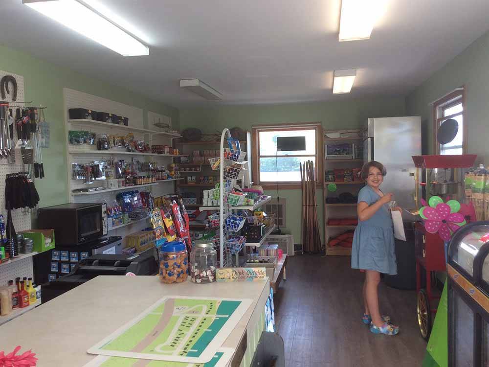 A person shopping in the general store at LUNDEEN'S LANDING