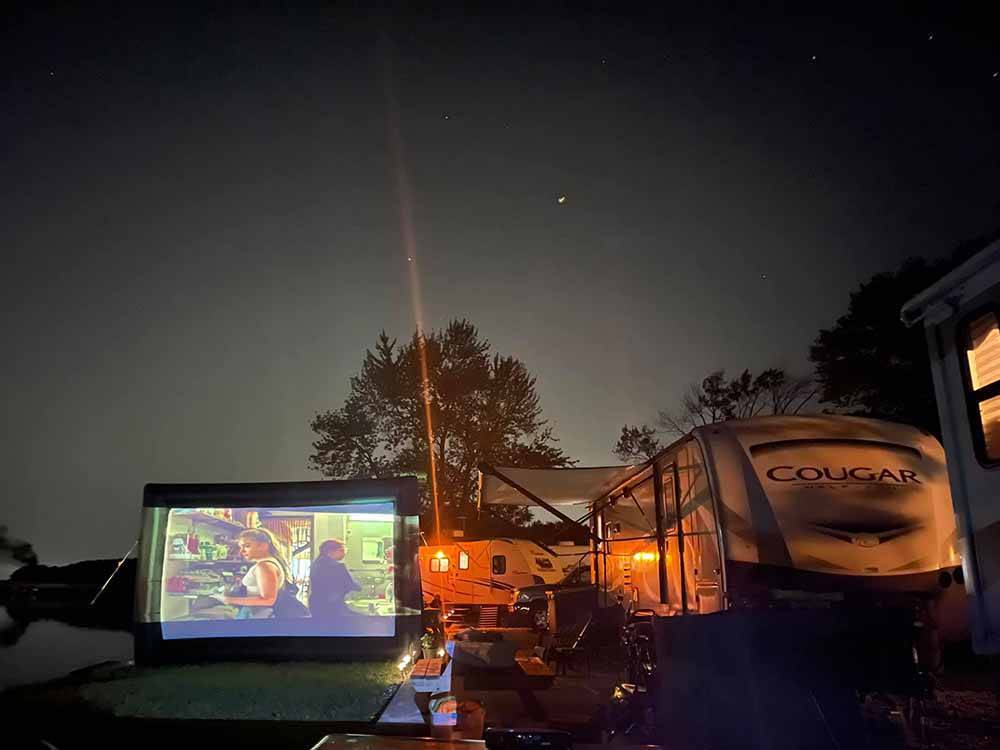 A large outdoor projected movie at LUNDEEN'S LANDING