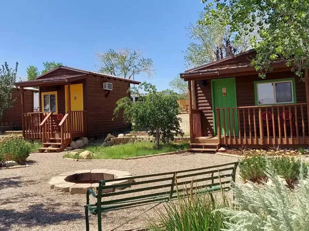 Guest cabins and a fire pit at CANYONS OF ESCALANTE RV PARK