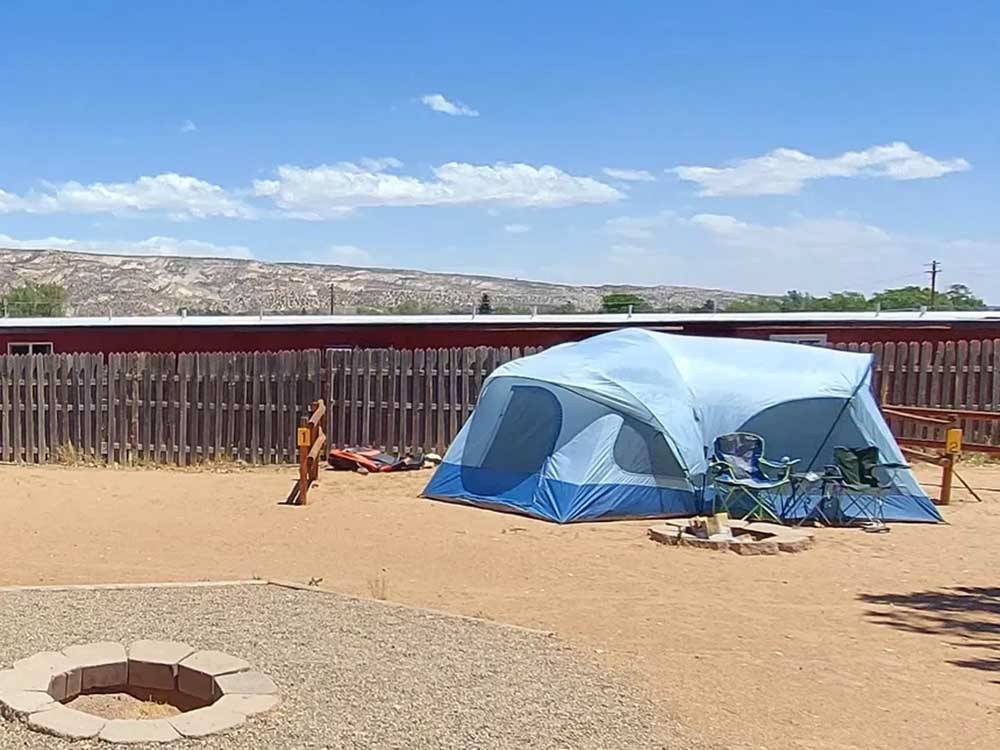 A tent pitched at a campsite at CANYONS OF ESCALANTE RV PARK