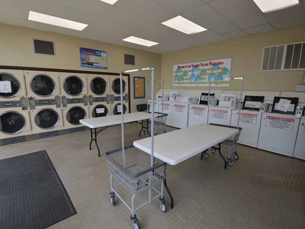 The clean laundry room at TRADERS VILLAGE RV PARK