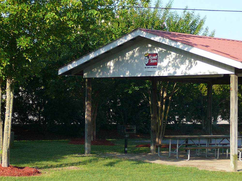The pavilion with picnic benches at BARNYARD RV PARK