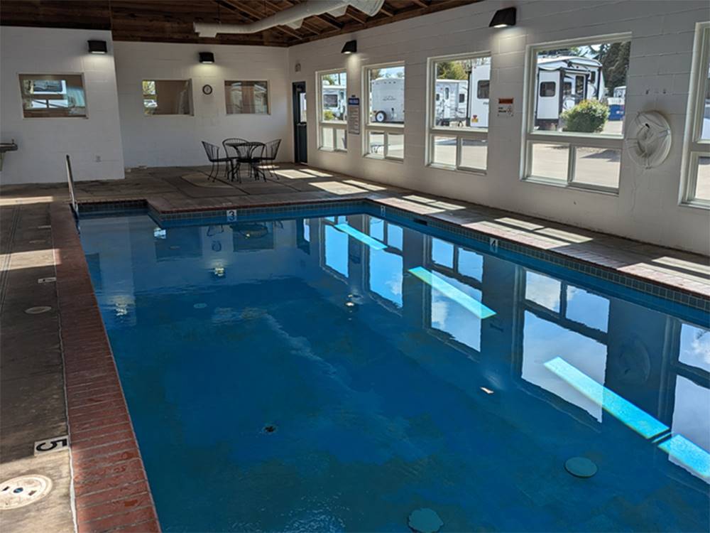 Interior pool area with large windows at Blue Ox RV Park