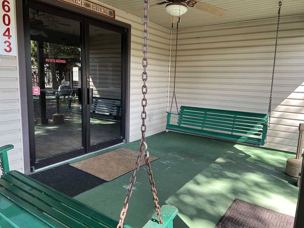 Porch swings at entrance at KELLY'S COUNTRYSIDE RV PARK