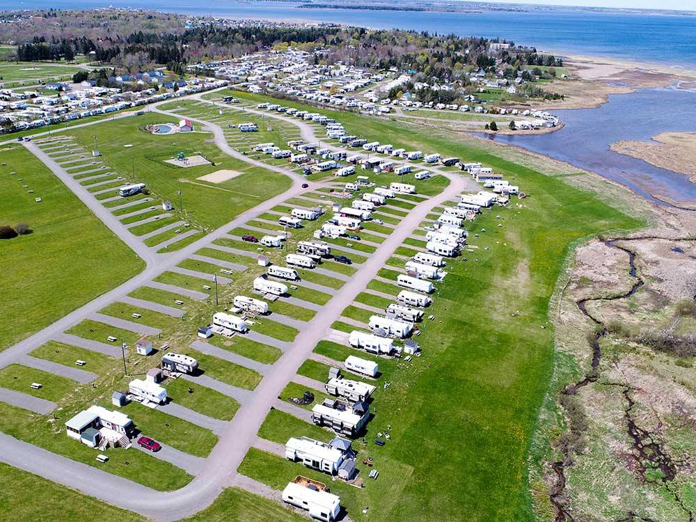 Aerial shot of paved sites surrounded by grass at OCEAN SURF RV PARK