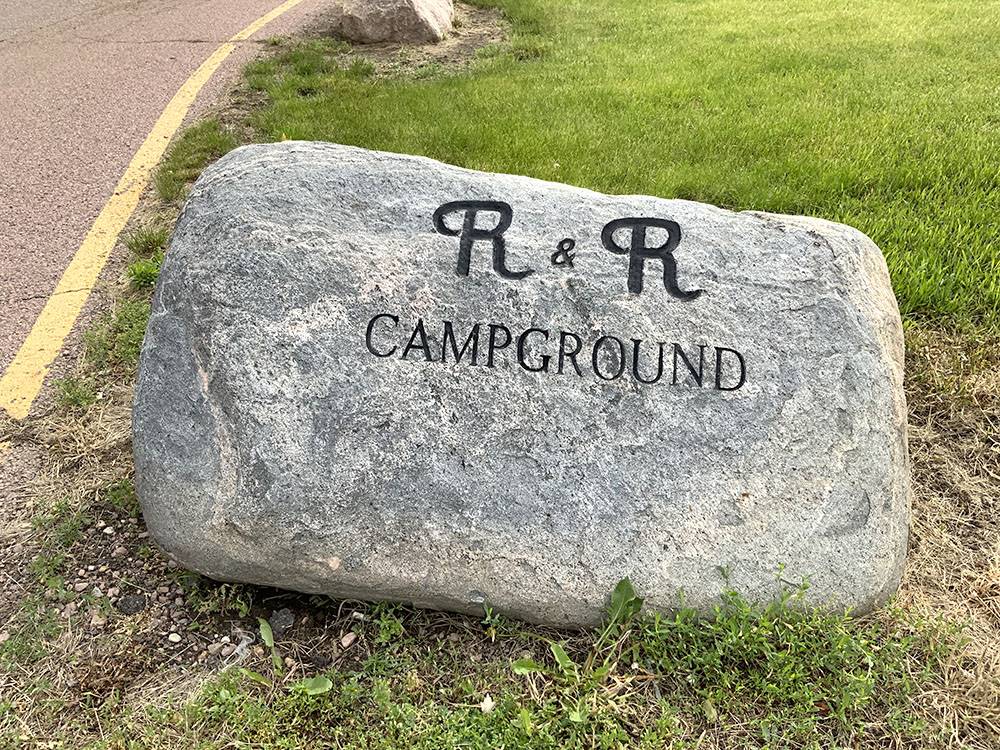 A rock with the campground name on it at R & R Campground & RV Park