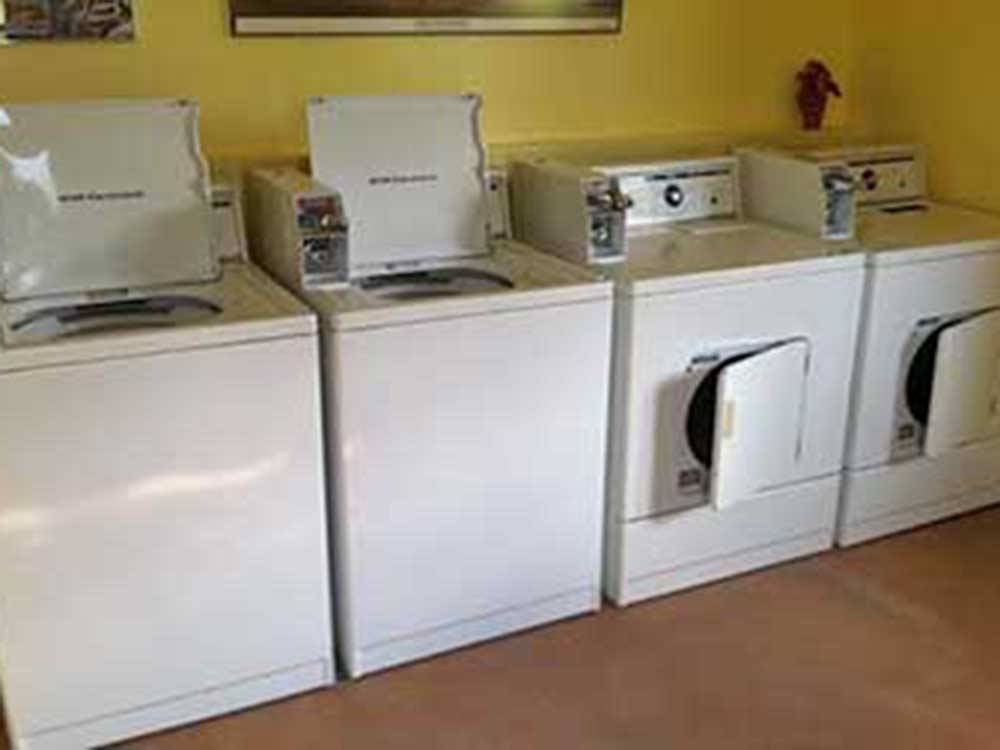 The washer and dryers in the laundry room at GRAPE CREEK RV PARK CAMPGROUND & CABINS