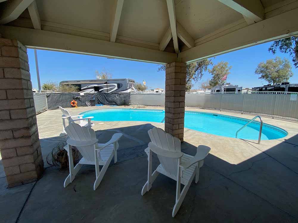 Shaded area facing pool at ALMOND TREE OASIS RV PARK