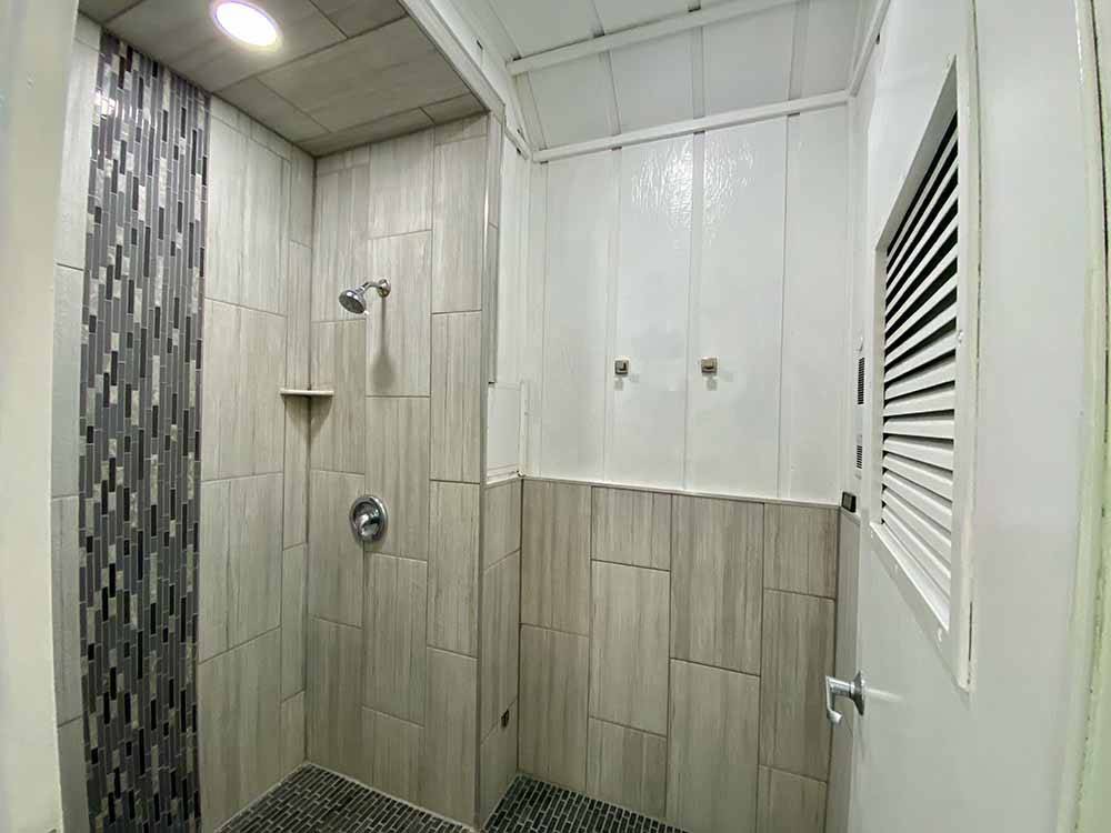 Private shower for guests at ALMOND TREE OASIS RV PARK