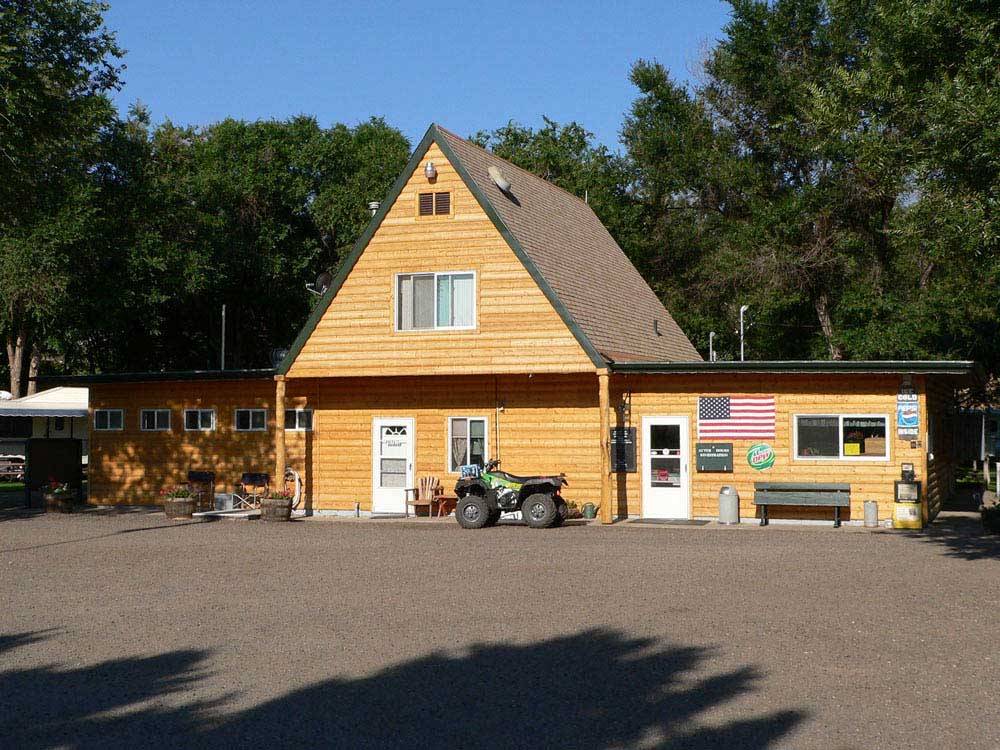 Wood general store with ATV in front at EAGLE RV PARK & CAMPGROUND