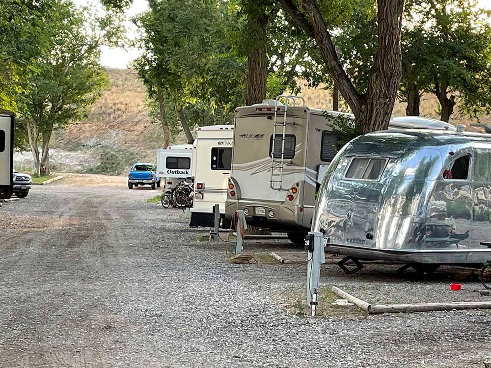 RVs parked at individual sites at EAGLE RV PARK & CAMPGROUND