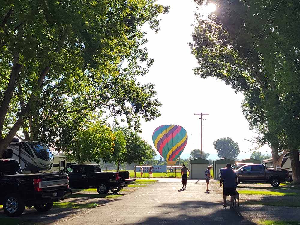 A hot air balloon on the ground nearby at FOSSIL VALLEY RV PARK