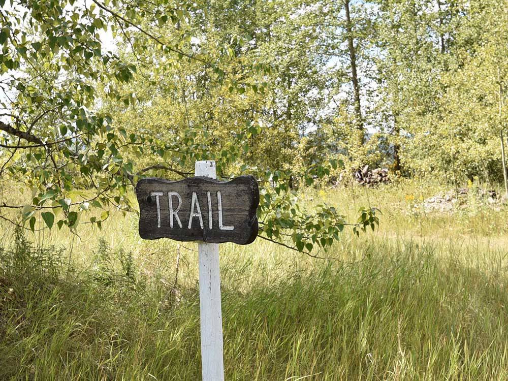 A sign identifying a trail at AIRPORT INN MOTEL AND RV PARK