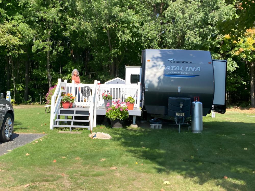 Parked trailer with patio at Kampvilla RV Park