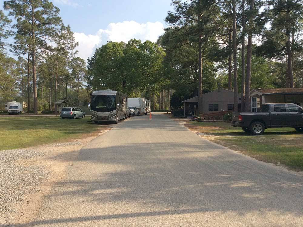 RVs and trailers at campground at SUGAR MILL RV PARK