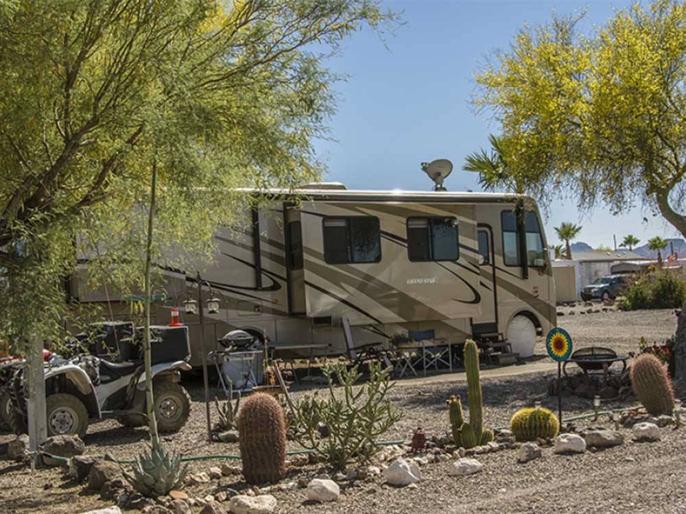 A motorhome parked in a site at BLACK ROCK RV VILLAGE