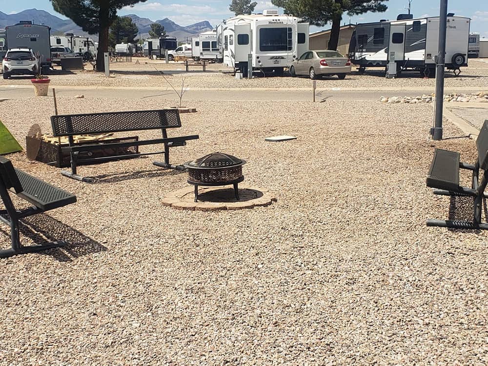 Fire pit with RVs in the background