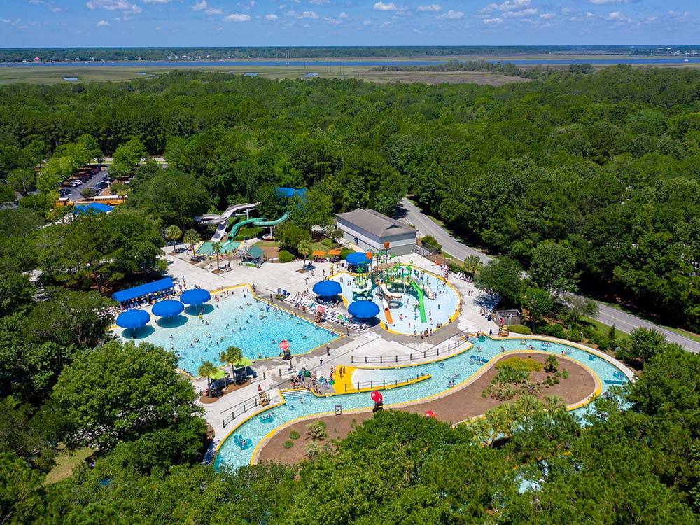 Aerial shot of buildings, pool and lazy river at THE CAMPGROUND AT JAMES ISLAND COUNTY PARK