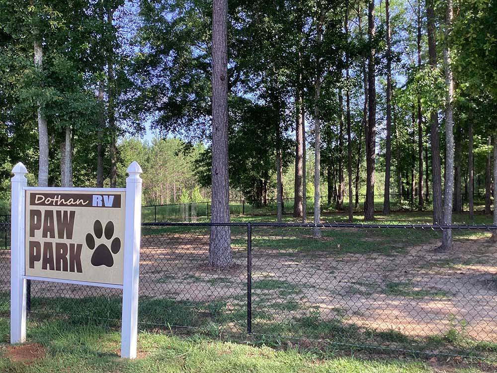 Sign in the fenced dog area at DOTHAN RV PARK