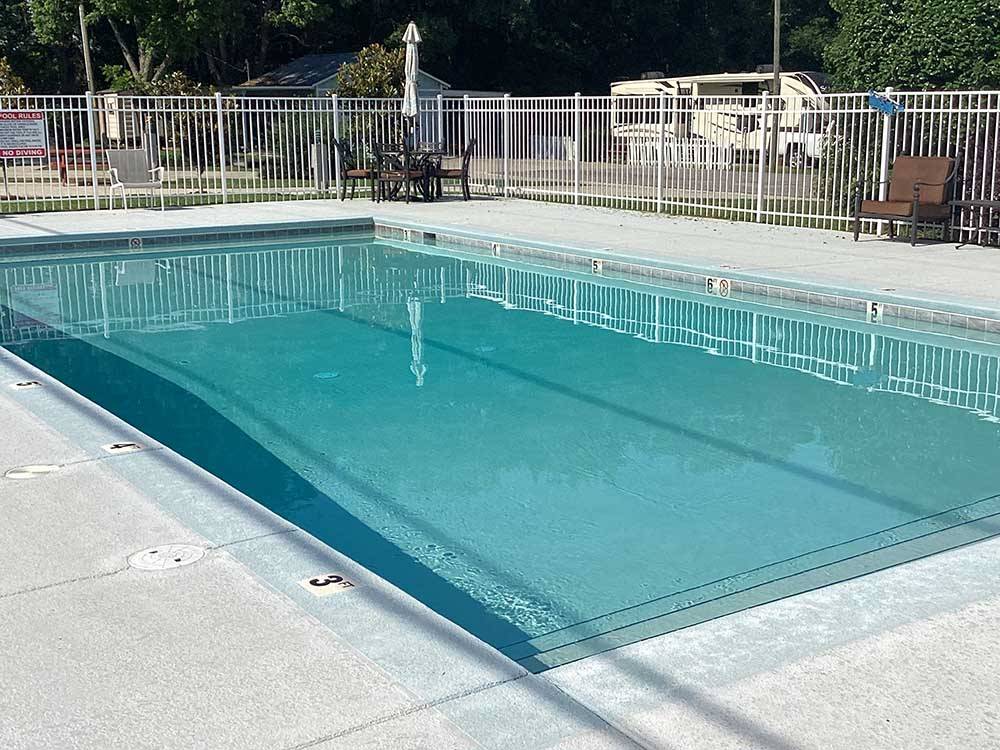 The fenced in swimming pool at DOTHAN RV PARK