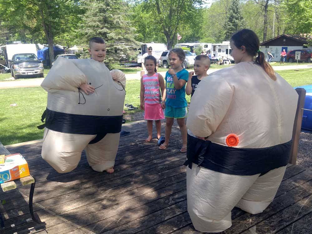 Two kids in inflatable sumo suits at LAKE BLUFF CAMPGROUND