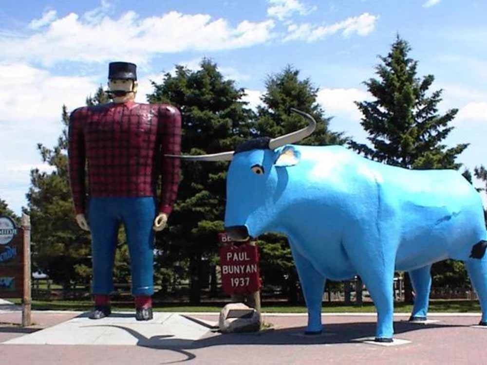 Large statues of Paul Bunyan and Babe the Blue Ox at ROYAL OAKS RV PARK