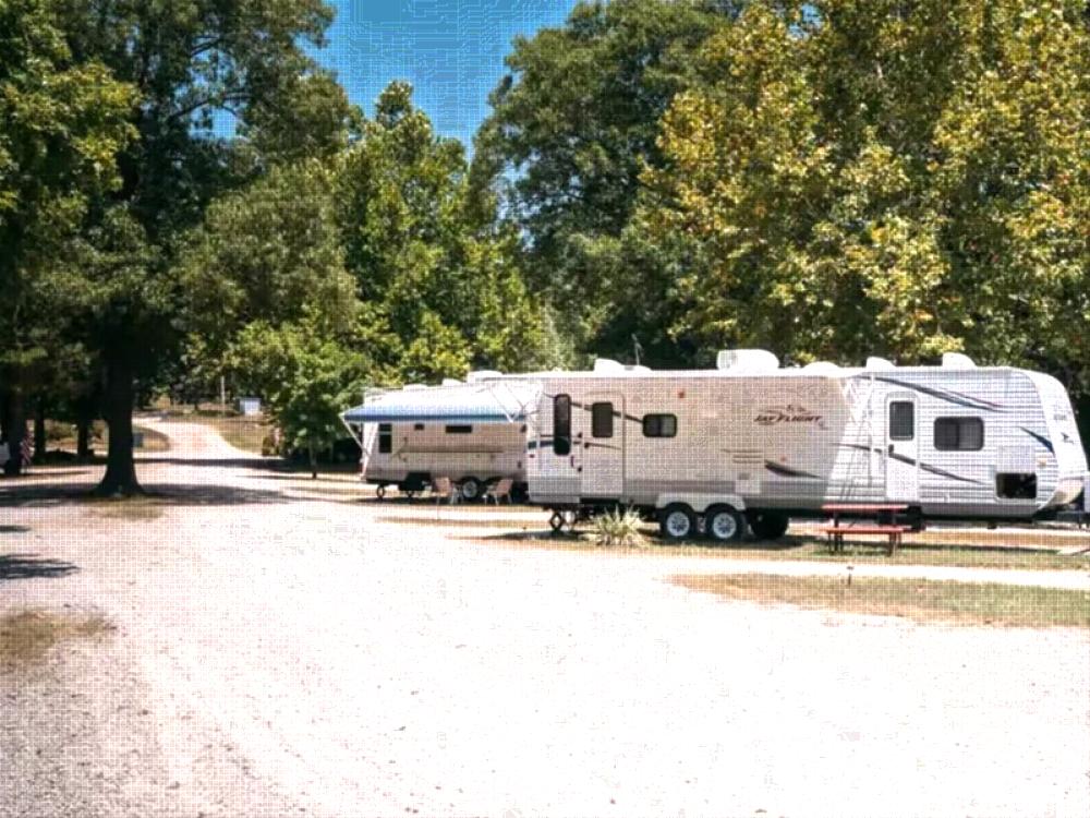 Parked trailers at site Arrowhead Point RV Park & Campground