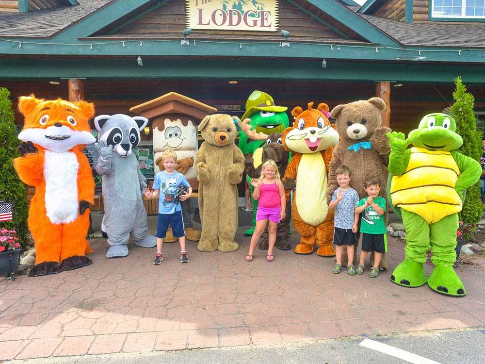 Kids with mascots at LAKE GEORGE ESCAPE CAMPGROUND