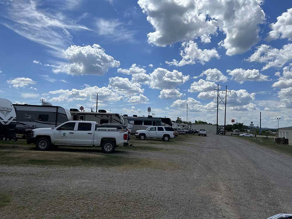 White clouds and a blue sky over the RV sites at OVERLAND RV PARK