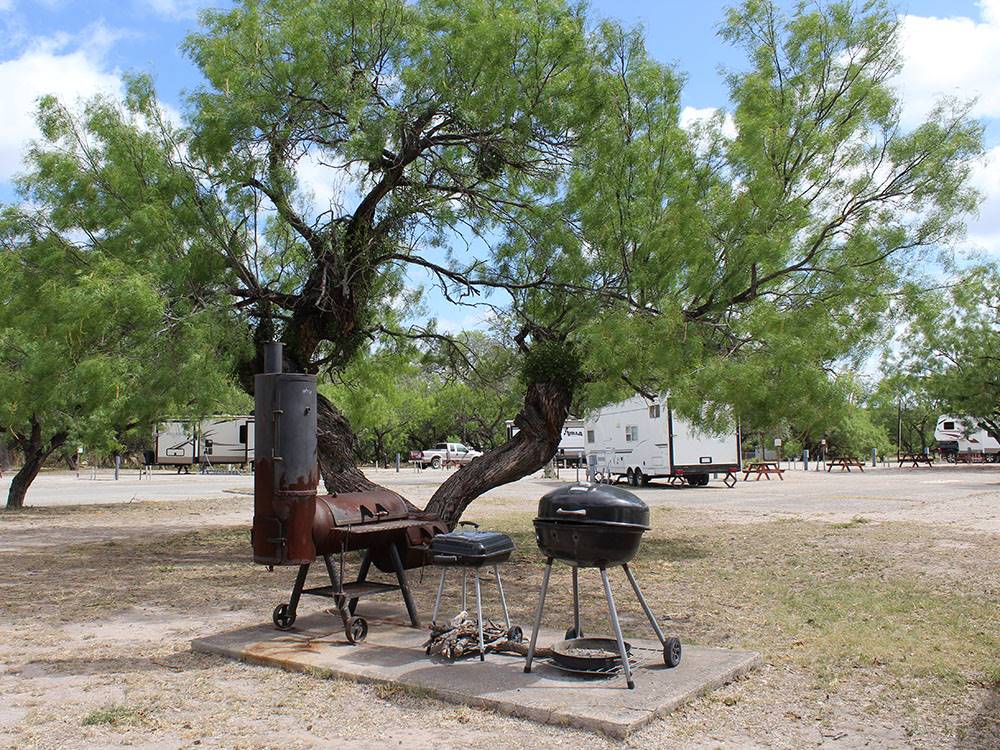 Three different types of barbecues at FORT CLARK SPRINGS RV PARK