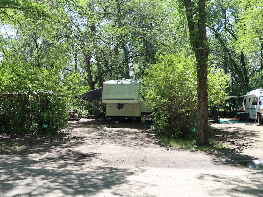 Fifth-wheel in a shady RV site at GORDON HOWE CAMPGROUND