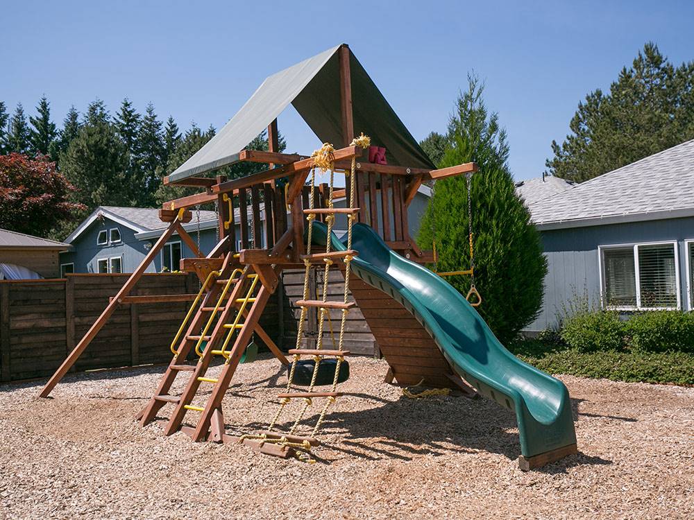 Wood playground structure at SUN OUTDOORS PORTLAND SOUTH