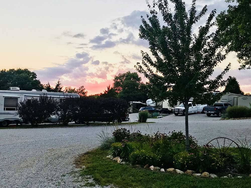 RVs parked outside at dusk at LAZY DAY CAMPGROUND