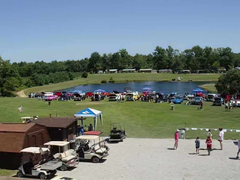 A car show next to the lake at TOWN & COUNTRY CAMP RESORT