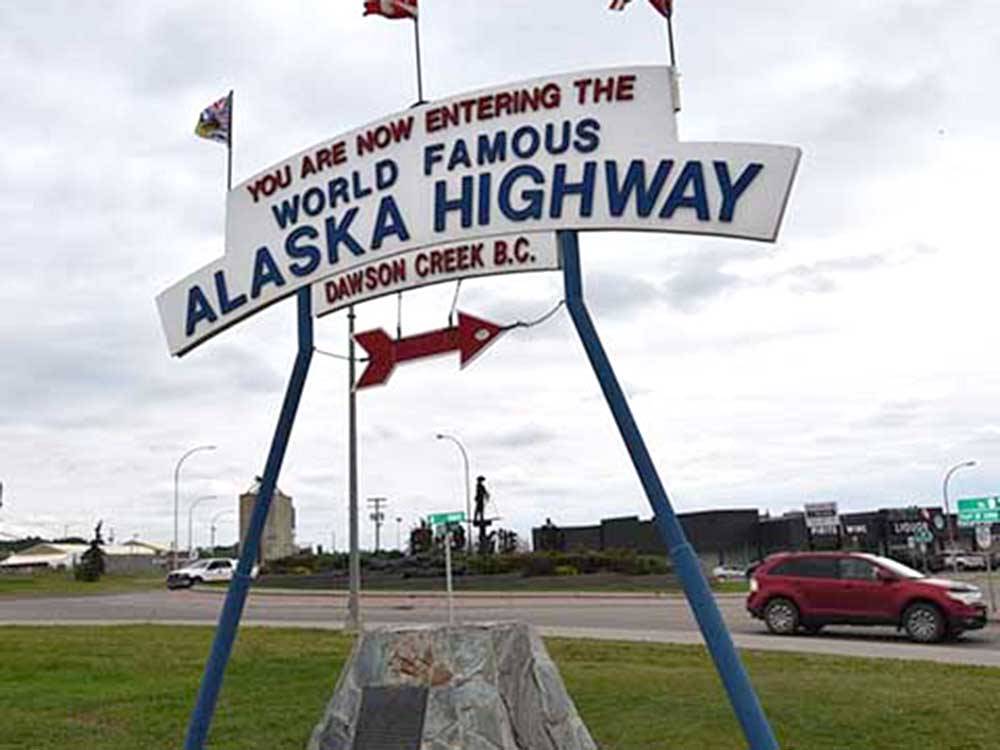 A large sign welcoming you to Alaska Highway at NORTHERN LIGHTS RV PARK