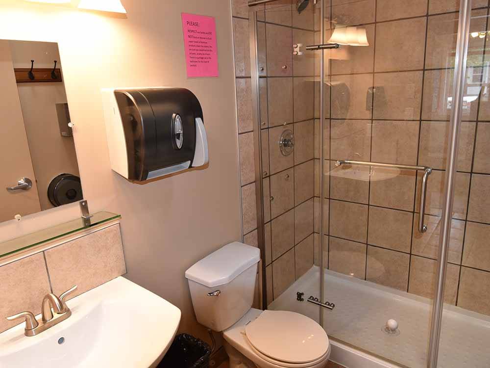 Well-appointed bathroom with tile and shower at NORTHERN LIGHTS RV PARK