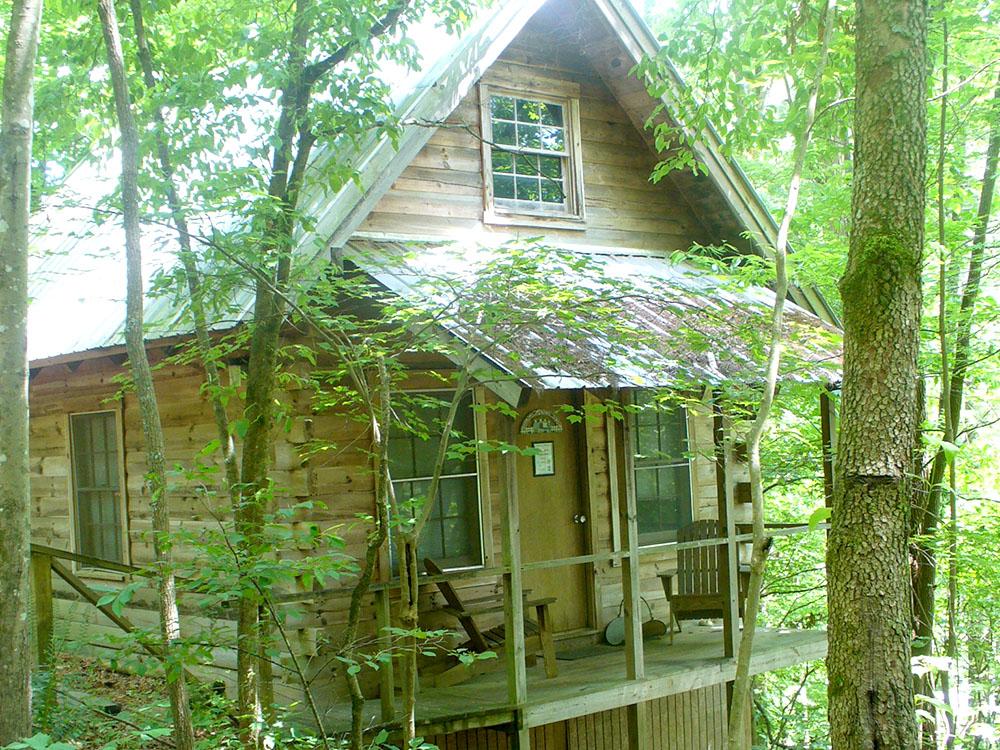 Wooden cabin at WHISPERING PINES CAMPGROUND & RV PARK
