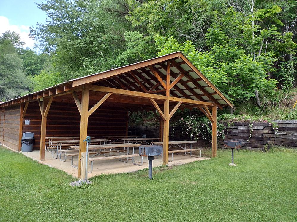 Wooden pavilion at WHISPERING PINES CAMPGROUND & RV PARK