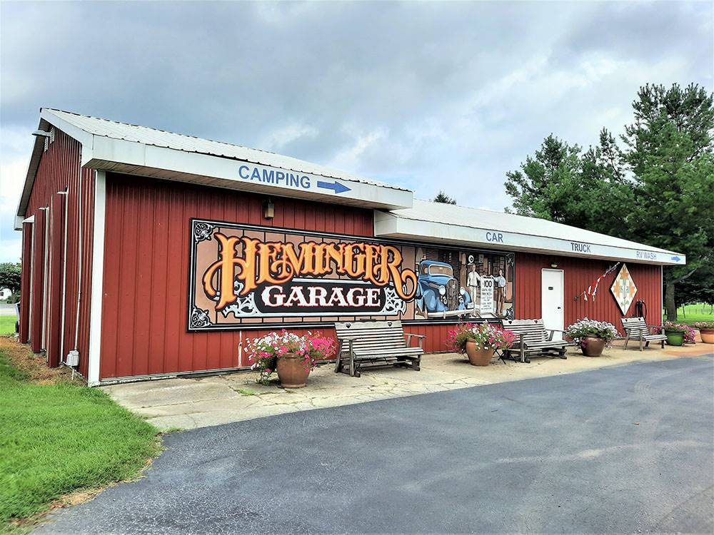 The Heminger Garage with benches at SHIPSHEWANA CAMPGROUND SOUTH PARK