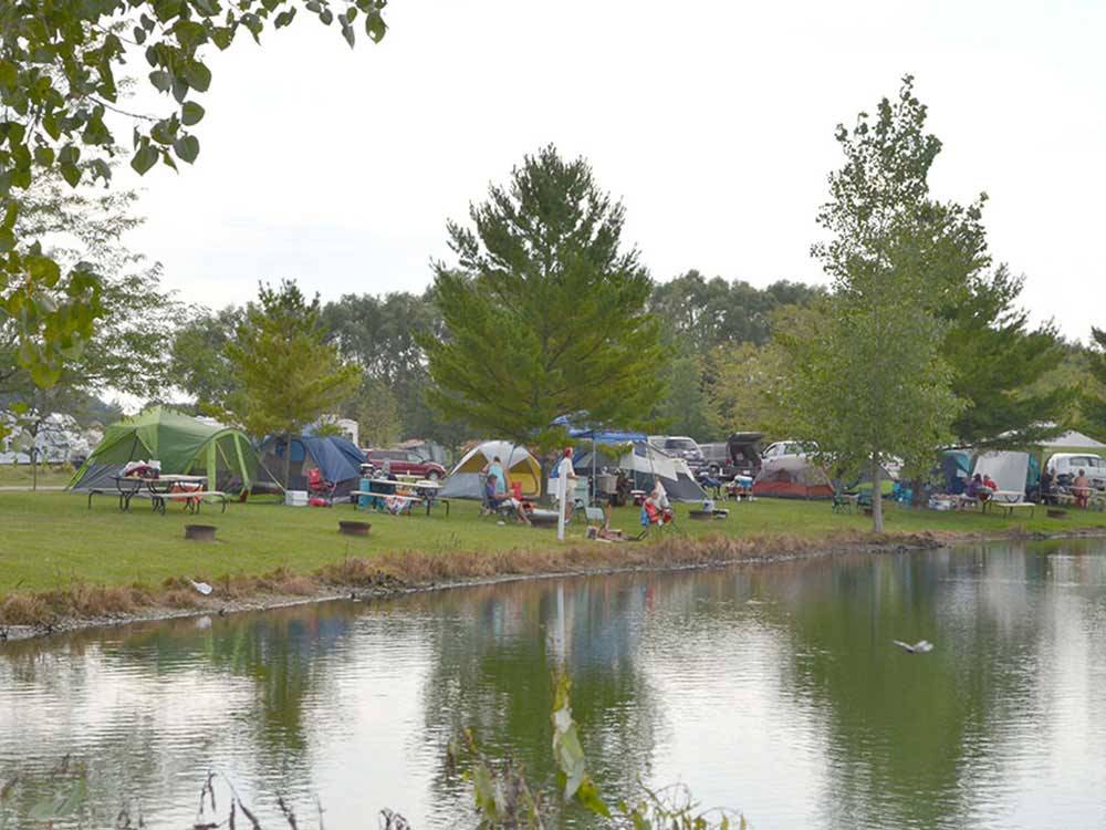 Tents camping on the water at SAUDER VILLAGE CAMPGROUND