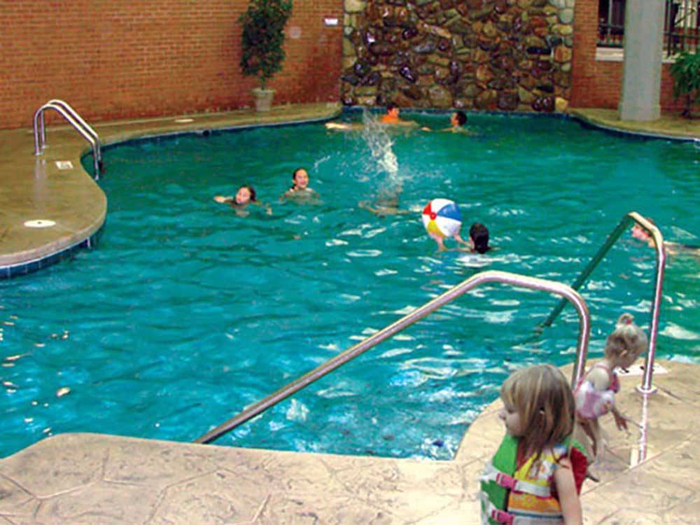 Kids swimming in the pool at SAUDER VILLAGE CAMPGROUND