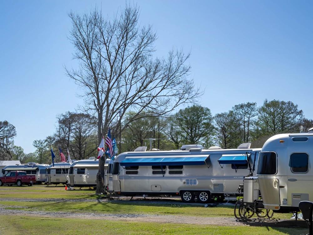 Parked trailers at site Bayou Wilderness RV Campground