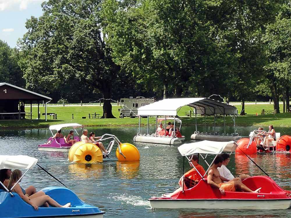 People riding in paddle boats at BAYLOR BEACH PARK WATER PARK & CAMPGROUND