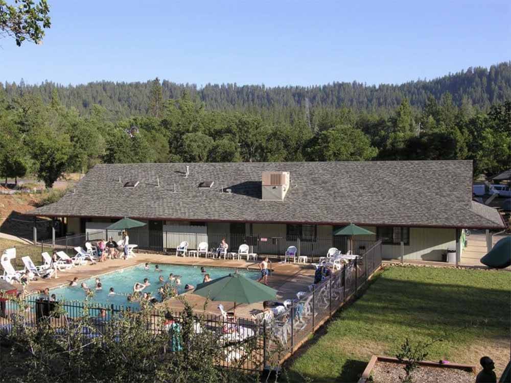 The swimming pool and main building at YOSEMITE PINES RV RESORT AND FAMILY LODGING
