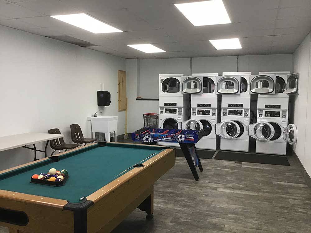 Pool table and laundry facilities at OWL CREEK MARKET + RV PARK